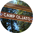 A Camp Oljato entrance sign.